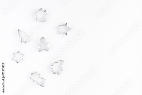 Cookie cutters on white background. Christmas, winter, new year concept. Flat lay, top view, copy space