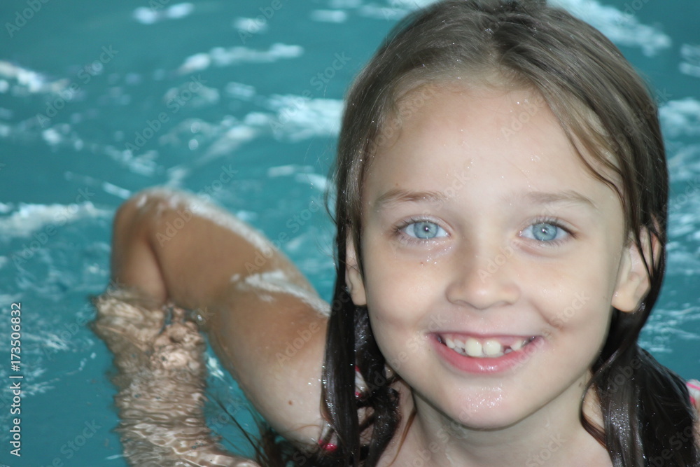 Young girl-child, playing in and, having fun in a swimming pool. Young girl-child, playing in and, having fun in a swimming pool.