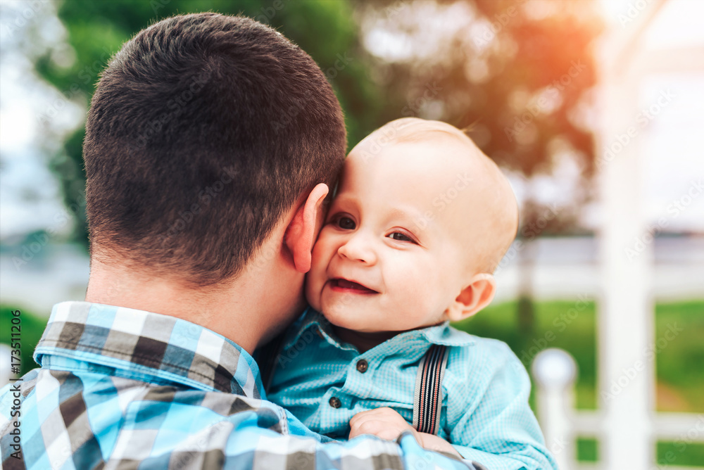 Happy young father with little son have fun outdoor in the park Happy young father with little son have fun outdoor in the park