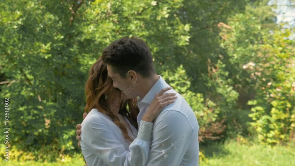 Young beautiful couple in white clothes, on a date in the park. Young beautiful couple in white clothes, on a date in the park.