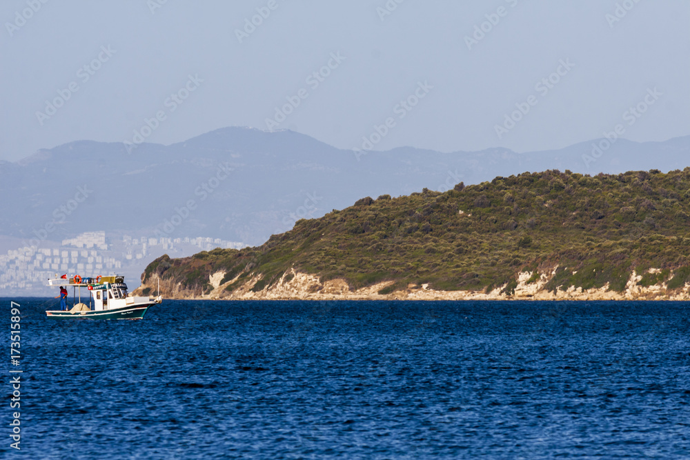 Fishing boat on the blue turkish aegean sea