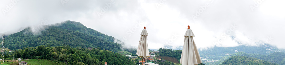 panorama dramatic view of valley with mist over the mountain and cloudy sky background in the morning, Mon Cham Valley, Chiangmai, Thailand. panorama dramatic view of valley with mist over the mountain and cloudy sky background in the morning, Mon Cham Valley, Chiangmai, Thailand.