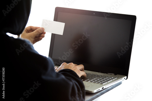 Fototapeta Naklejka Na Ścianę i Meble -  Hacker is hacking a card by using old laptop.