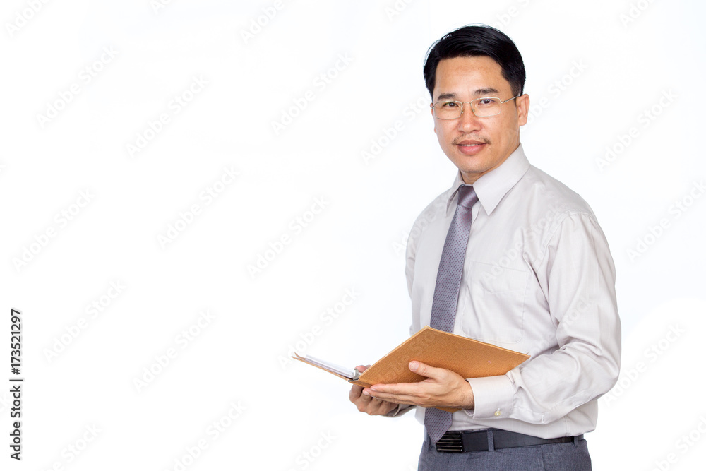 Business man holding a book on solid white clear background. Business man holding a book on solid white clear background.