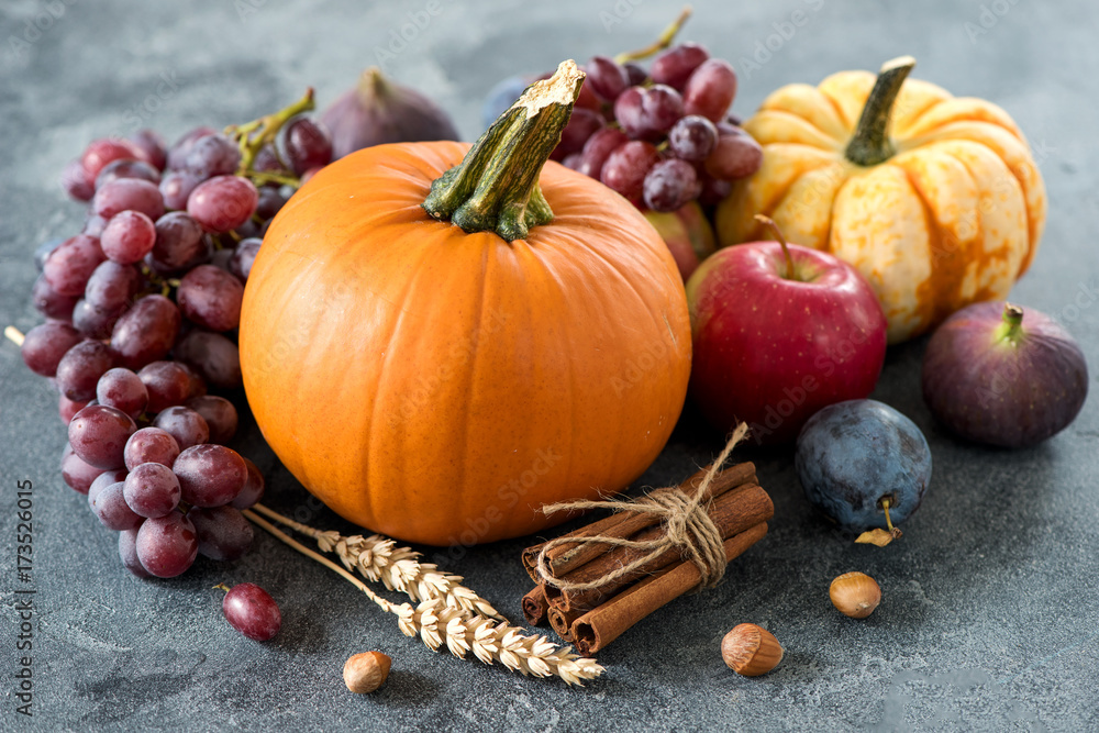 Autumn harvest with pumpkin, grapes, plumps, figs, apples. Thanksgiving still life Autumn harvest with pumpkin, grapes, plumps, figs, apples. Thanksgiving still life