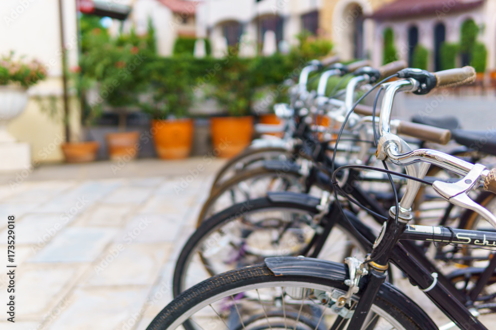 Obraz premium horizontal perspective view of front part of public bicycle in town. bicycle ecology and energy saving concept.