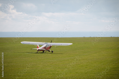Small propeller airplane private towing aircraft on the contryside field England