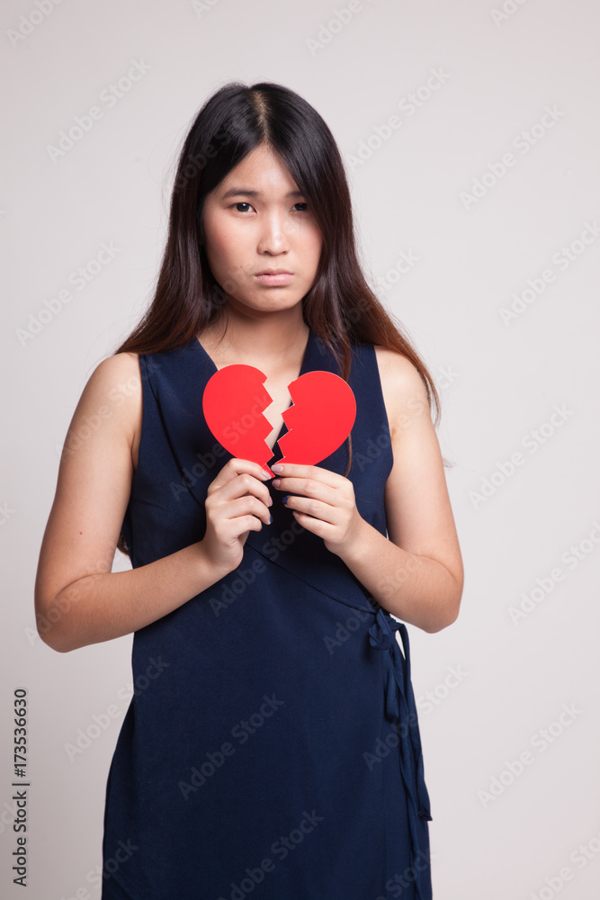 Beautiful young Asian woman with broken heart. Beautiful young Asian woman with broken heart.