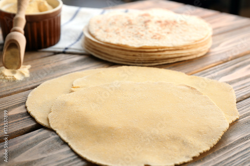 Rolled dough for tortillas on kitchen table