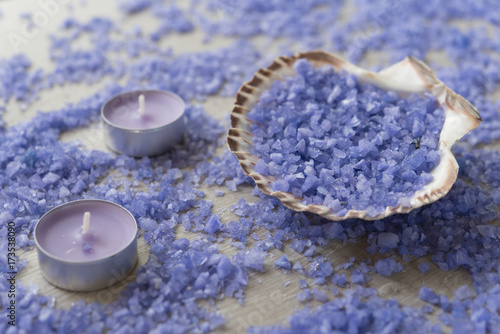 Seashell filled with sea salt and two purple  candles