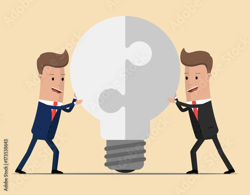 Two businessmen unite lamp of the puzzle. Joining forces, the birth of a new idea