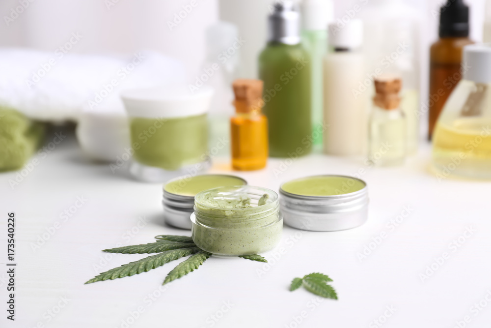 Cosmetics with hemp extract on white table