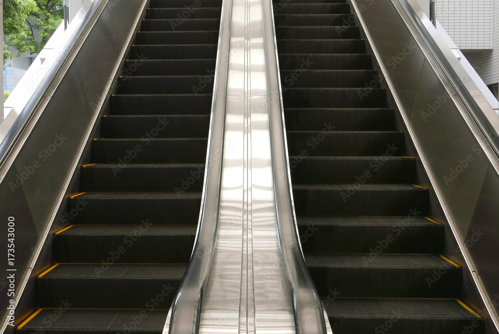 Up and down escalator from perspective view Up and down escalator from perspective view
