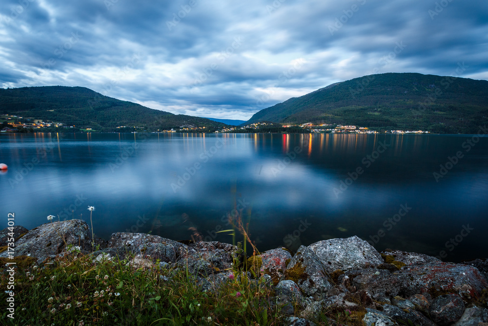 Hafslovatnet lake at night with city reflection