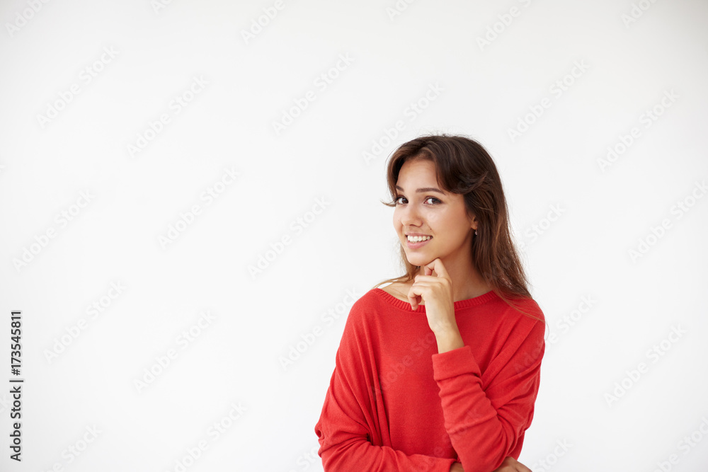 Positive human emotions, feelings, attitude and life perception. Picture of cheerful young lady wearing red top in studio having happy look, rejoicing at good positive news, grinning broadly at camera Positive human emotions, feelings, attitude and life perception. Picture of cheerful young lady wearing red top in studio having happy look, rejoicing at good positive news, grinning broadly at camera
