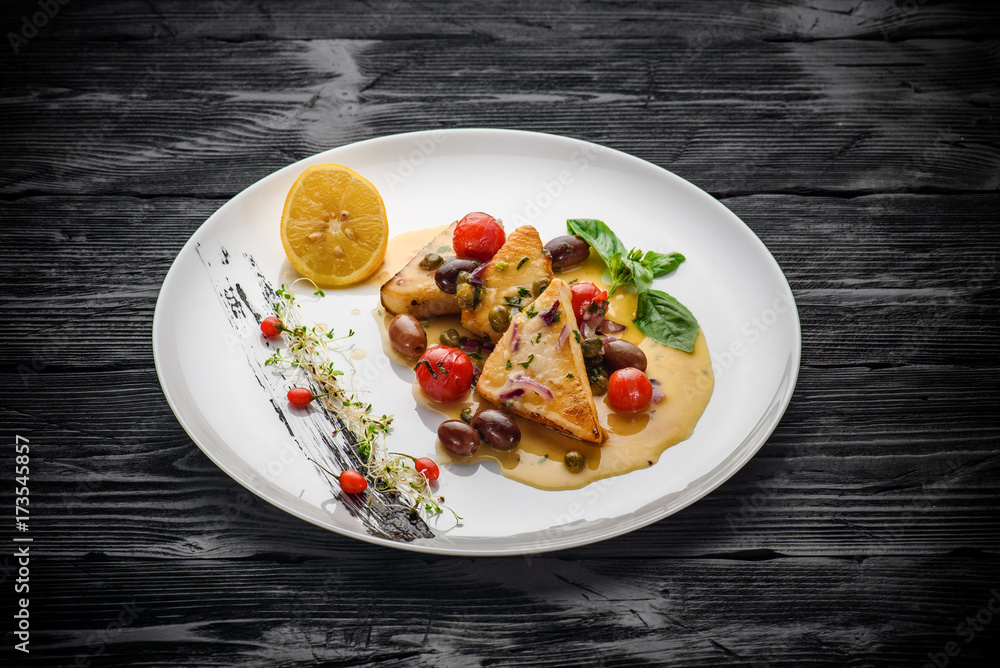 Swordfish fillet prepared by the Sicilian recipe. Decorated with goji. Swordfish fillet prepared by the Sicilian recipe. Decorated with goji.