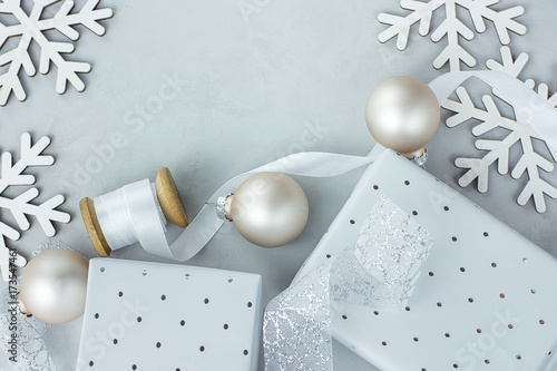 White Christmas Decoration Ornaments Frame Composition Gift Boxes Balls Snow Flakes Silk Swirl Ribbon Poster Banner Template Copy Space