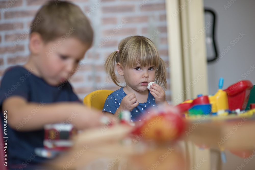 Obraz premium Curious children playing in kindergarten