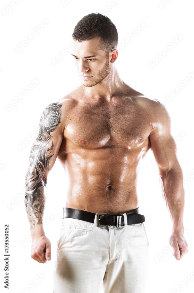 Fototapeta premium Sexy muscular fitness model with tattooed torso