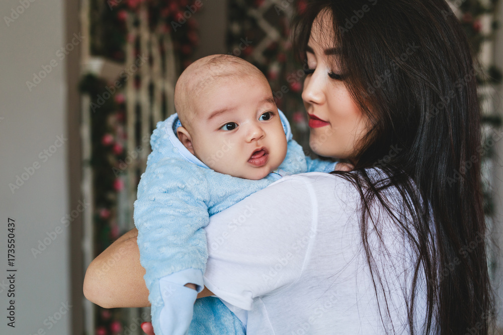 Portrait of a happy young Japanese or Asian mom and her baby Portrait of a happy young Japanese or Asian mom and her baby