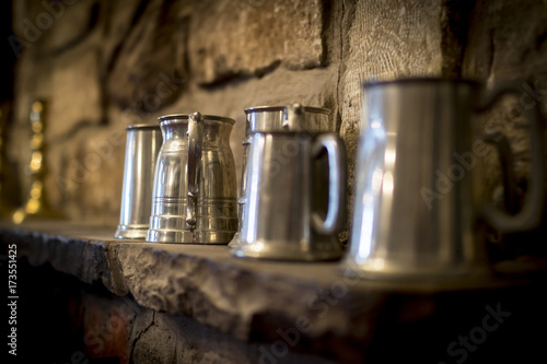 Traditional pewter tankard in a traditional English pub photo