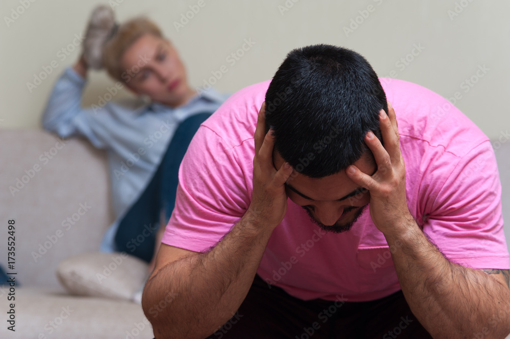 Man and woman sitting separately after quarrel Man and woman sitting separately after quarrel