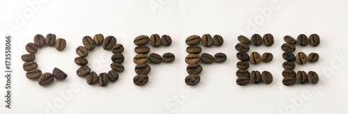 Word of coffee beans on white background