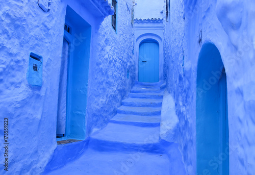 Street with stairs in Medina of Chefchaouen, Morocco. Chefchaouen or Chaouen is known that the houses in this old town are painted in the striking, variously blue hued © Mariana Ianovska
