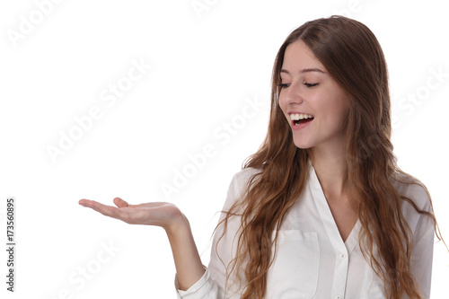 Photos Young beautiful woman with perfect smile holding something on her hand isolated