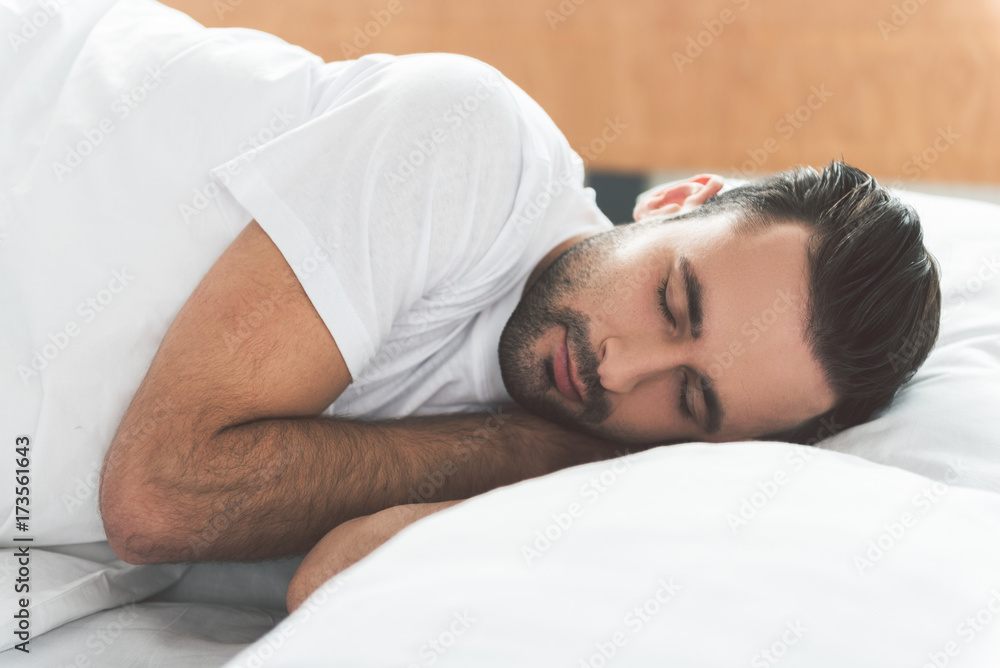 Serene man sleeping on his bed Serene man sleeping on his bed