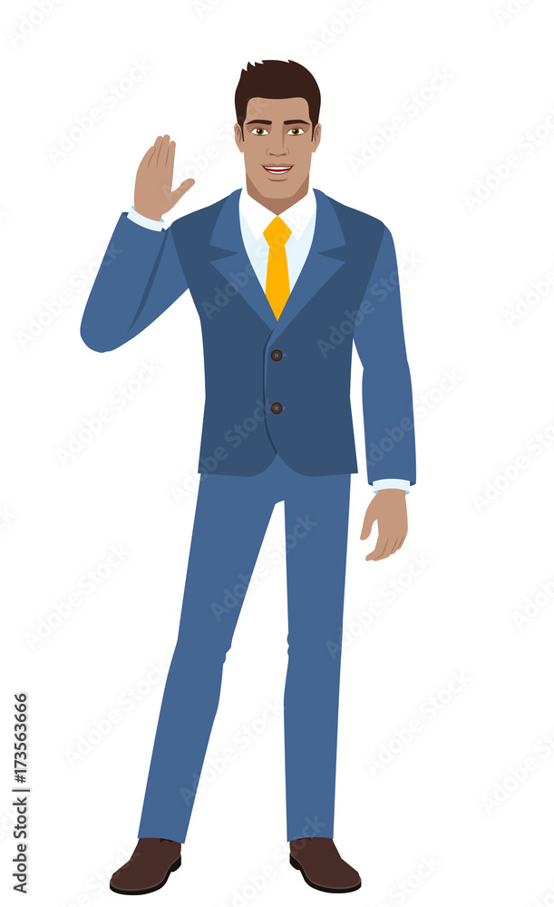 Businessman greeting someone with his hand raised up