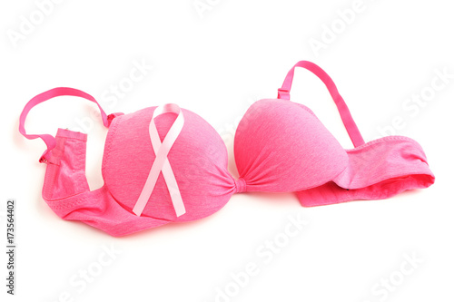Pink ribbon with female bra on white background
