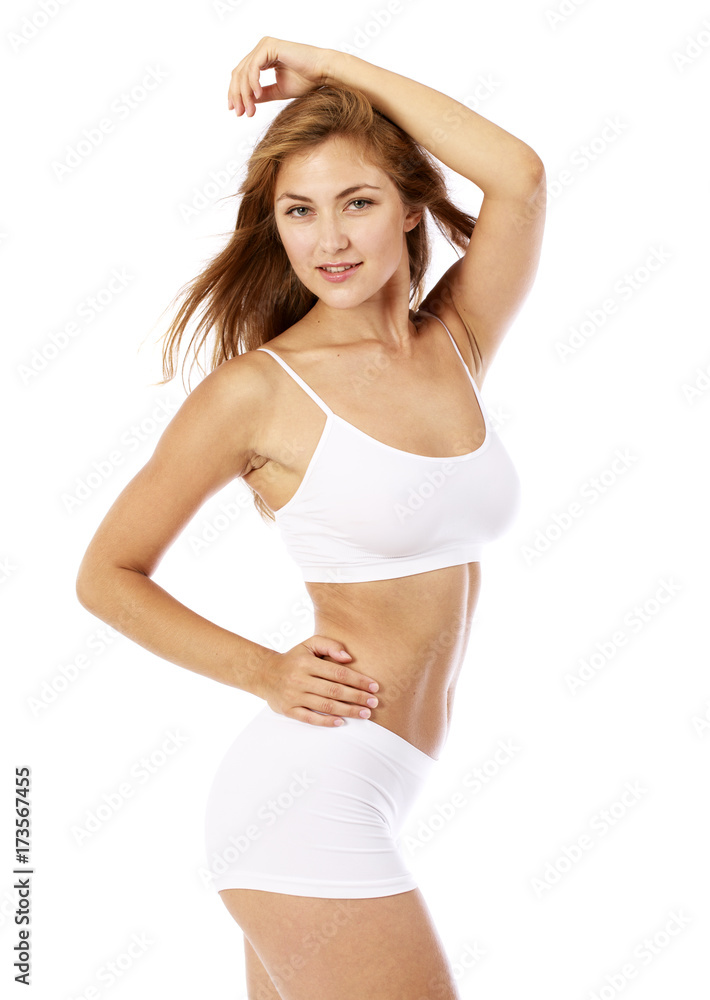 Young beautiful blonde woman in white fitness clothing Young beautiful blonde woman in white fitness clothing