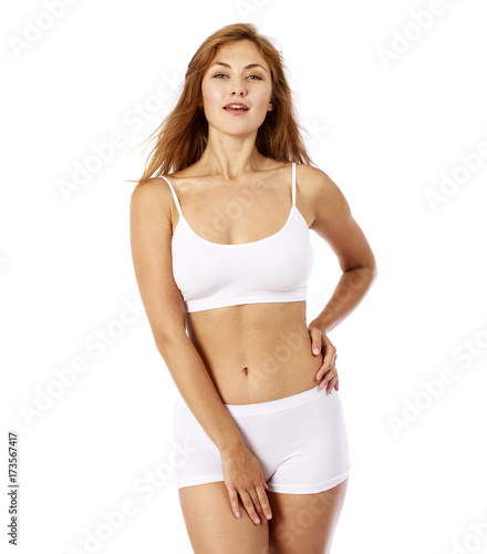 Young beautiful blonde woman in white fitness clothing