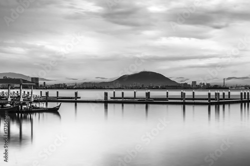 Boat yard with a distant mountain © ChyeSeng