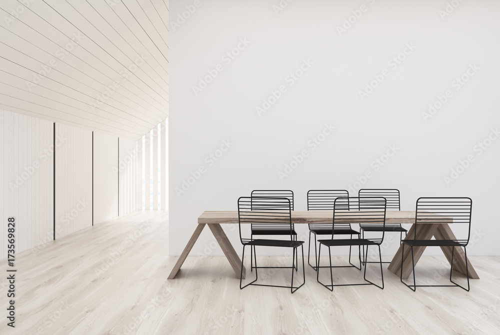 White kitchen with a wooden table White kitchen with a wooden table
