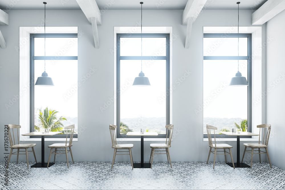 Fototapeta premium White cafe interior wooden tables