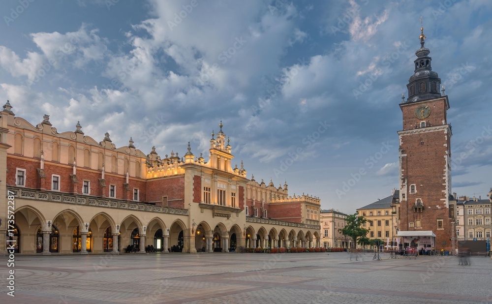 Cloth Hall and Town Hall tower on the Main Market Square in Krakow, illuminated in the morning