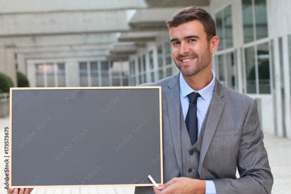 Elegant man holding a board with space for copy Elegant man holding a board with space for copy