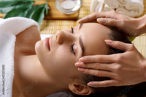 Portrait of young Beautiful woman having relaxing in spa massage salon. Leisure. Spa. Massage procedure. Healthy lifestyle and relaxation concept