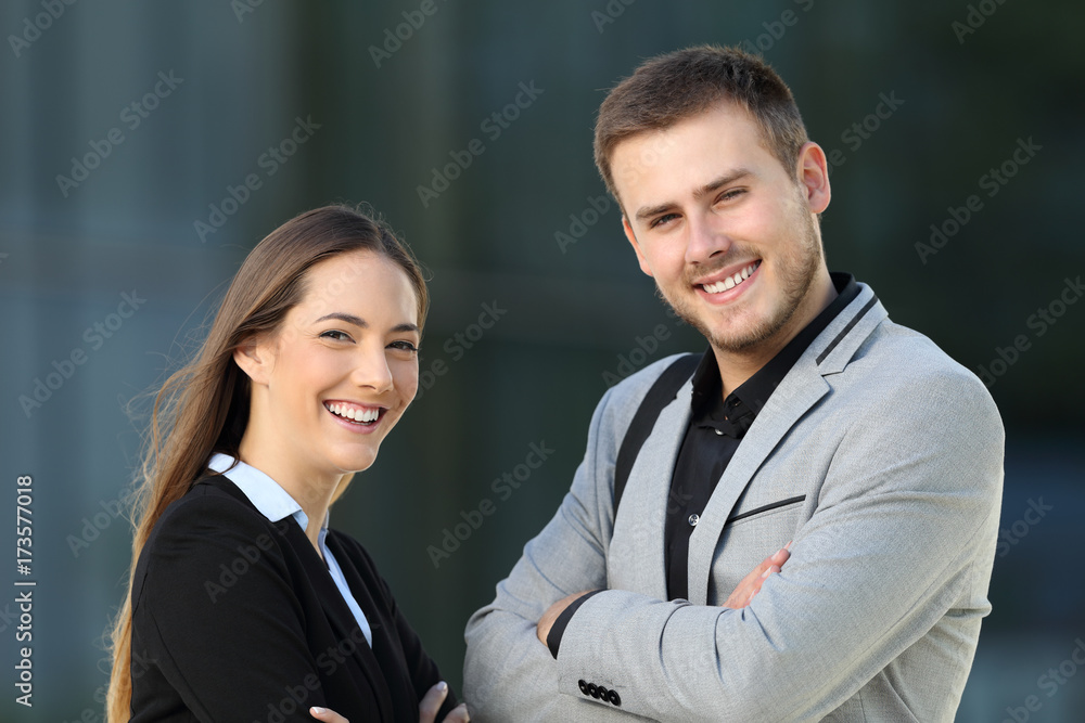 Couple of executives posing on the street Couple of executives posing on the street
