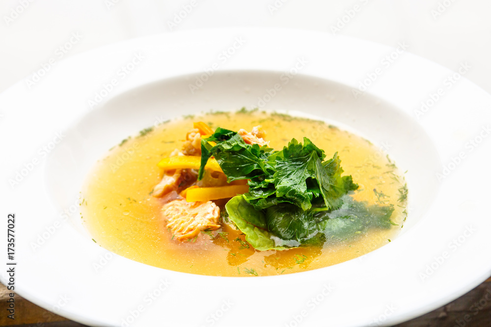 Fish soup with salmon and clear broth.