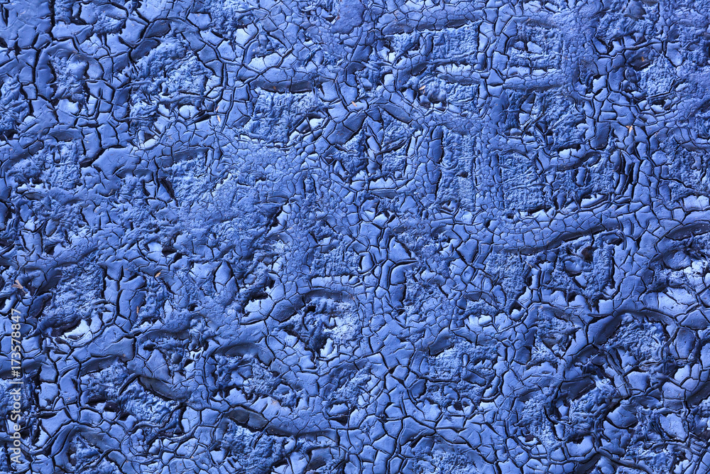 An old blue painted surface with peeling paint for textures, backgrounds and creativity. An old blue painted surface with peeling paint for textures, backgrounds and creativity.