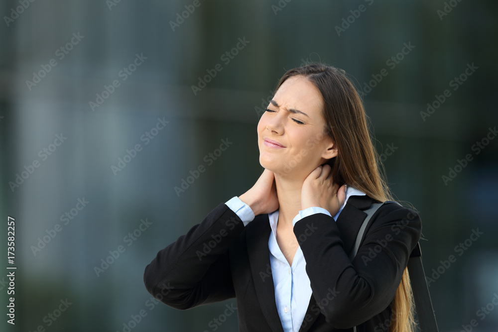 Executive suffering neck ache on the street Executive suffering neck ache on the street