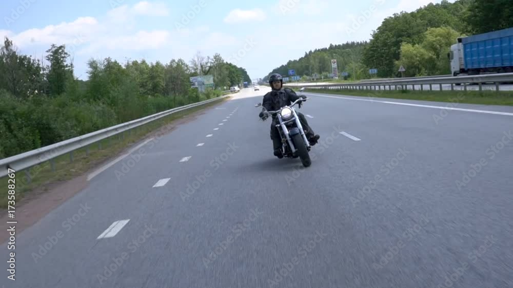 Motorcyclist maneuvers on the road Motorcyclist maneuvers on the road