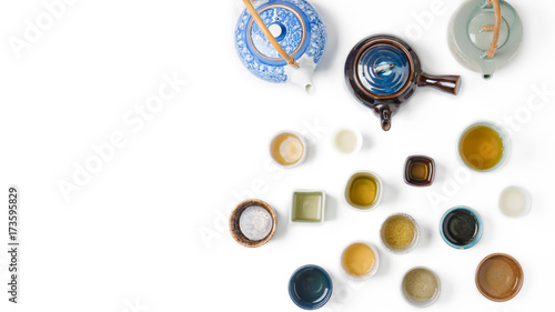 Cup of tea with teapot isolated on white background, top view