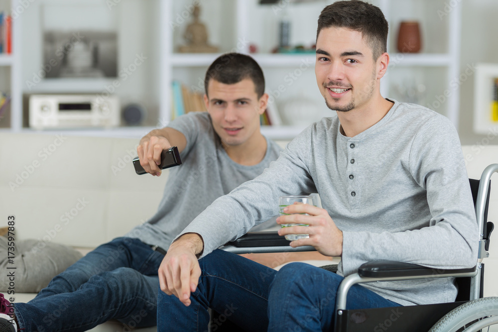 helping a friend in a wheelchair helping a friend in a wheelchair