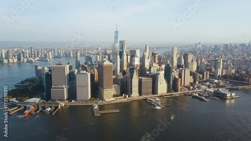Aerial view of busy New York city in America, Manhattan district on the shore of East river. Drone flies to city centre.