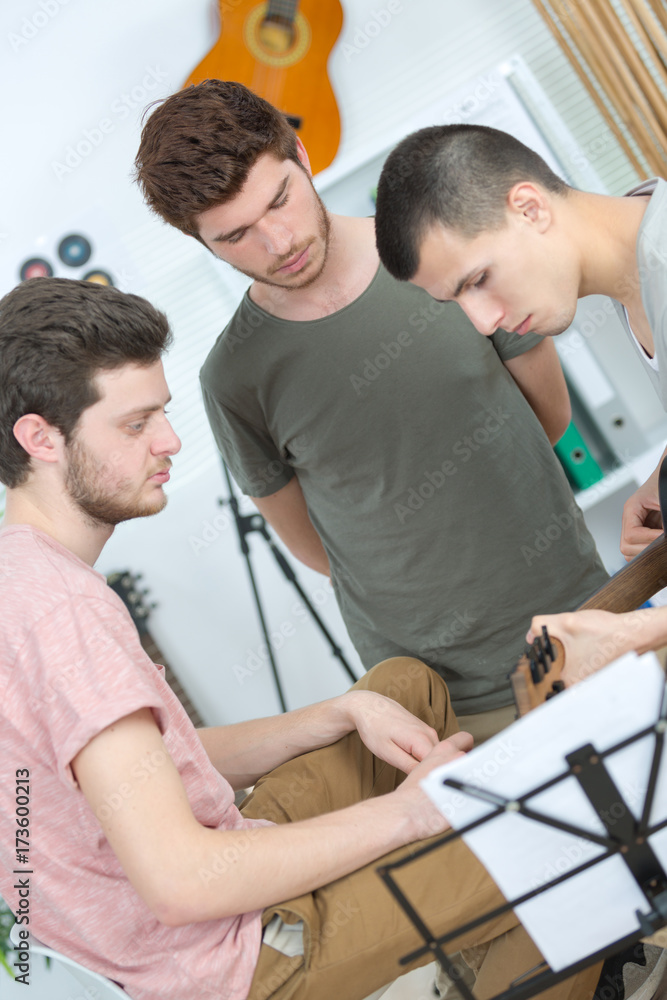Obraz premium young band music playing a song in a recording studio