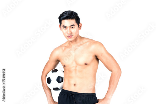 fitness man holding a soccer ball on white background